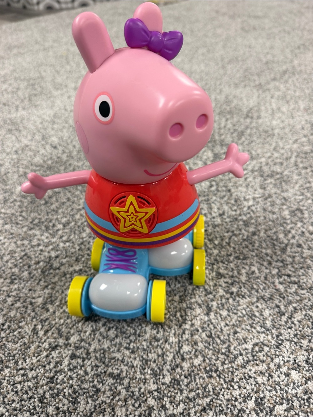 Peppa Pig Pink Roller Figure with Purple Bow and Red Outfit